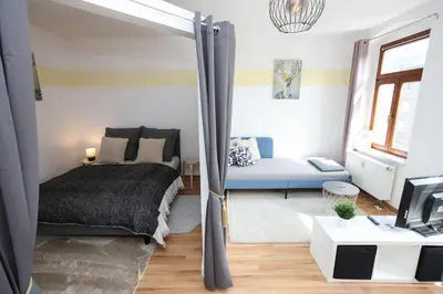 Ein Bett oder Betten in einem Zimmer der Unterkunft FullHouse - Chemnitz - M45 Apartments