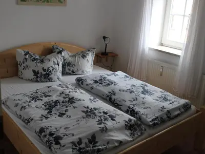 Ein Bett oder Betten in einem Zimmer der Unterkunft Ferienwohnung in Struppen