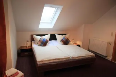 Ein Bett oder Betten in einem Zimmer der Unterkunft Ferienwohnung Lilienstein