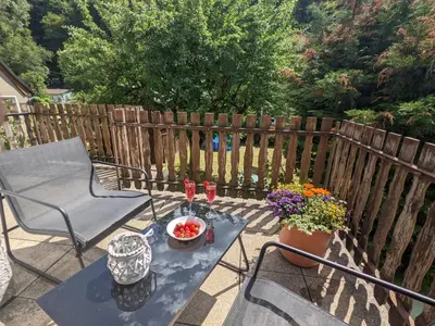 Ein Balkon oder eine Terrasse in der Unterkunft H4 - Urlaubsmagie - Kleiner Wohlfühlort mit Pool