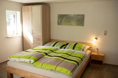 Ein Bett oder Betten in einem Zimmer der Unterkunft Ferienwohnung-Ihle Olbernhau