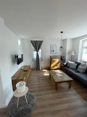 Ein Sitzbereich in der Unterkunft Apartmenthaus Elbblick Mühlberg