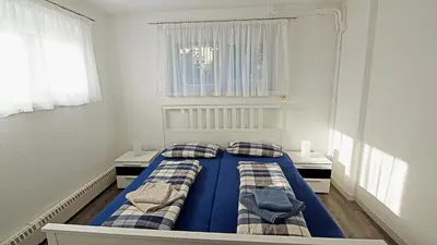 Ein Bett oder Betten in einem Zimmer der Unterkunft Ferienwohnung Richter