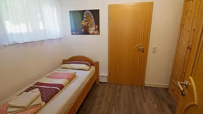 Ein Bett oder Betten in einem Zimmer der Unterkunft Ferienwohnung Richter