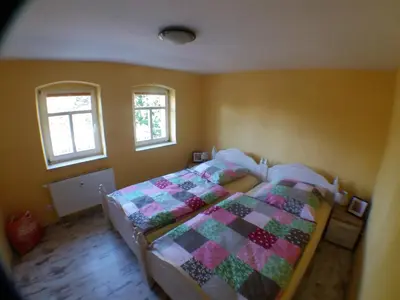 Ein Bett oder Betten in einem Zimmer der Unterkunft FeWo Dorn EG Haus Sandsteinliebe