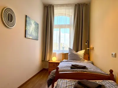 Ein Bett oder Betten in einem Zimmer der Unterkunft Ferienwohnungen Landeskrone Dresden
