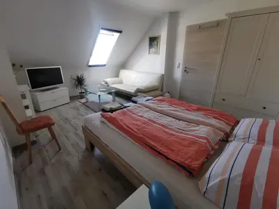 Ein Bett oder Betten in einem Zimmer der Unterkunft Schmetterling Zimmer