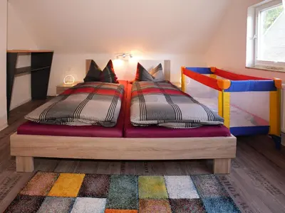 Ein Bett oder Betten in einem Zimmer der Unterkunft Ferienhäuser Olbernhau Erzgebirge