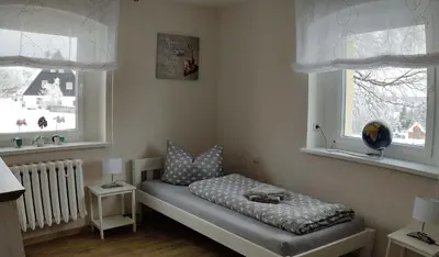 Ein Bett oder Betten in einem Zimmer der Unterkunft Ferienwohnung Zum Ausblick