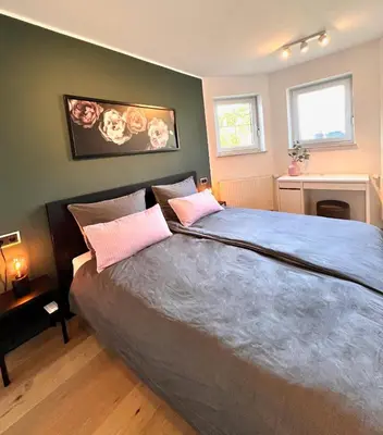 Ein Bett oder Betten in einem Zimmer der Unterkunft Luxus Ferienhaus Erzgebirge in Alleinlage