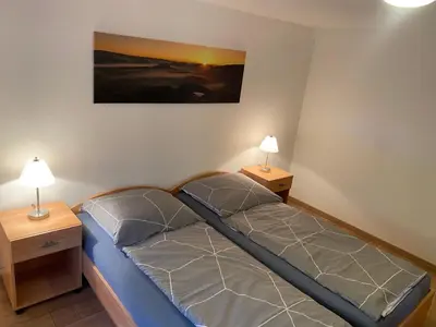 Ein Bett oder Betten in einem Zimmer der Unterkunft Ferienwohnung Pintaske