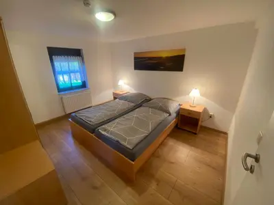 Ein Bett oder Betten in einem Zimmer der Unterkunft Ferienwohnung Pintaske