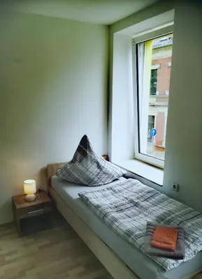 Ein Bett oder Betten in einem Zimmer der Unterkunft Ferienwohnung Karsten - nahe Chemnitz