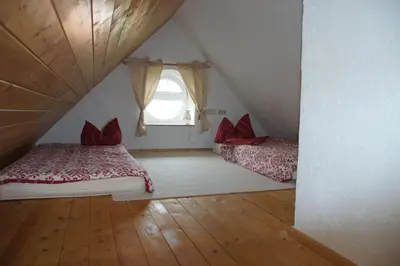 Ein Bett oder Betten in einem Zimmer der Unterkunft Schwalbennest Kaisitz