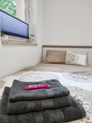 Ein Bett oder Betten in einem Zimmer der Unterkunft Altstadt-FeWo-Freiberg