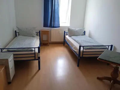 Ein Bett oder Betten in einem Zimmer der Unterkunft Apartments K11 für Monteure in Chemnitz