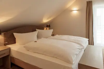 Ein Bett oder Betten in einem Zimmer der Unterkunft Elbresort Kurort Rathen