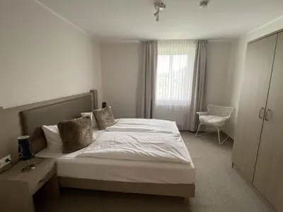 Ein Bett oder Betten in einem Zimmer der Unterkunft Landhaus Weißig & Rathen