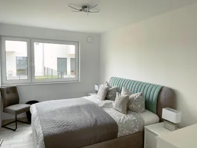 Ein Bett oder Betten in einem Zimmer der Unterkunft Exklusives Apartment mit Blick auf den See