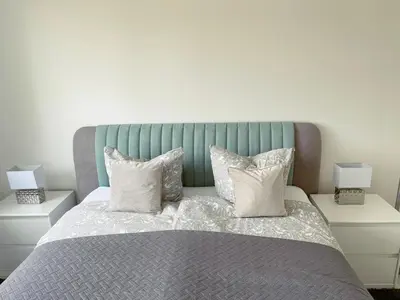 Ein Bett oder Betten in einem Zimmer der Unterkunft Exklusives Apartment mit Blick auf den See