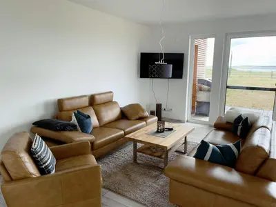 Ein Sitzbereich in der Unterkunft Exklusives Apartment mit Blick auf den See