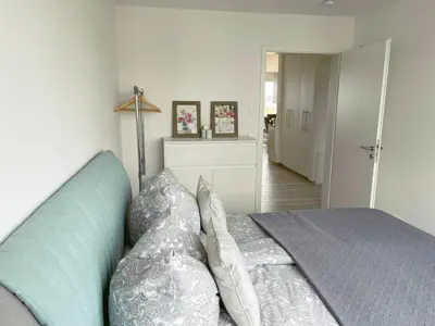 Ein Bett oder Betten in einem Zimmer der Unterkunft Exklusives Apartment mit Blick auf den See