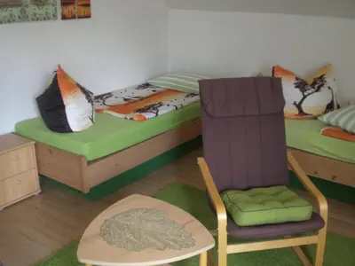 Ein Bett oder Betten in einem Zimmer der Unterkunft Ferienwohnung im Erzgebirge in Gelenau