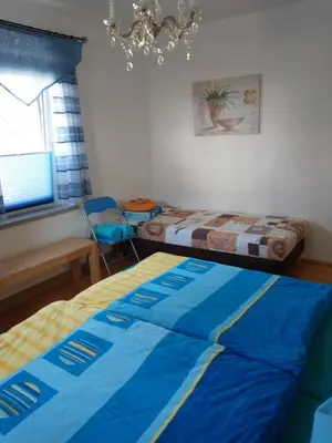 Ein Bett oder Betten in einem Zimmer der Unterkunft Ferienwohnung im Erzgebirge in Gelenau