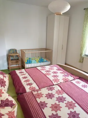 Ein Bett oder Betten in einem Zimmer der Unterkunft Ferienwohnung im Erzgebirge in Gelenau