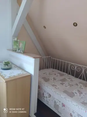Ein Bett oder Betten in einem Zimmer der Unterkunft Kreativ Ferienwohnung Domizil der Sinne