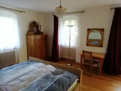 Ein Bett oder Betten in einem Zimmer der Unterkunft Ferienwohnung mit Charme in Dresden Pillnitz EG