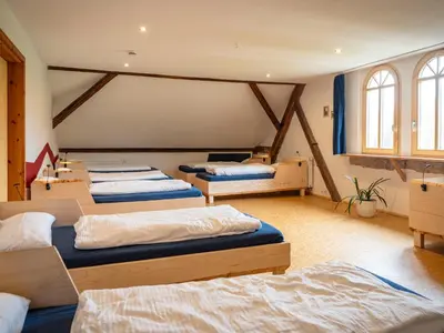 Ein Bett oder Betten in einem Zimmer der Unterkunft Hinterland Hostel