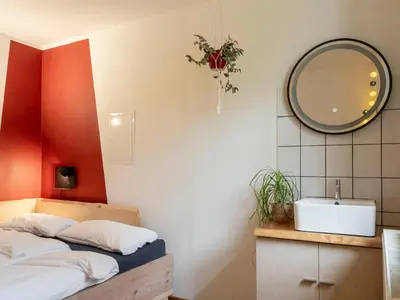 Ein Bett oder Betten in einem Zimmer der Unterkunft Hinterland Hostel