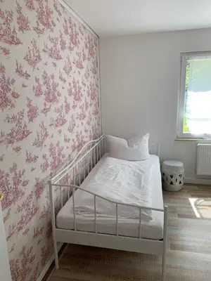 Ein Bett oder Betten in einem Zimmer der Unterkunft Kuckuckswinkel Ferienwohnung Zarah