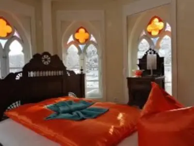 Ein Bett oder Betten in einem Zimmer der Unterkunft Rittergut Schloss Niederforchheim