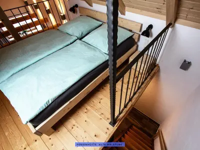 Ein Bett oder Betten in einem Zimmer der Unterkunft Ferienhäuser Seiffen
