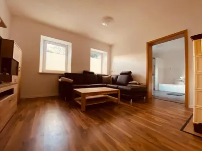 Ein Sitzbereich in der Unterkunft Ferienwohnung Nennigmühle