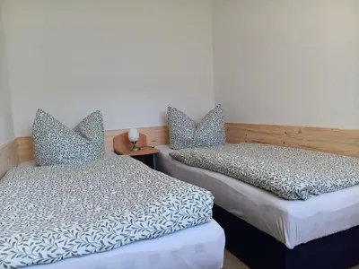 Ein Bett oder Betten in einem Zimmer der Unterkunft Ferienwohnung Füssel am Malerweg