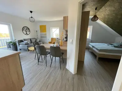Ein Bett oder Betten in einem Zimmer der Unterkunft Moderne Wohnung mit Balkon inmitten der Lausitz