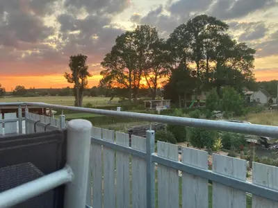 Blick auf den Sonnenuntergang/Sonnenaufgang von der Ferienwohnung aus oder aus der Nähe