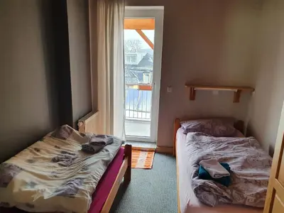Ein Bett oder Betten in einem Zimmer der Unterkunft Apartment mit Balkon