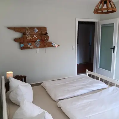 Ein Bett oder Betten in einem Zimmer der Unterkunft Roter Milan