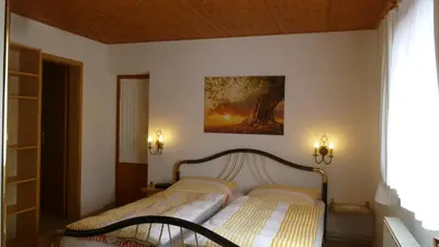 Ein Bett oder Betten in einem Zimmer der Unterkunft Ferienwohnung Frenzel