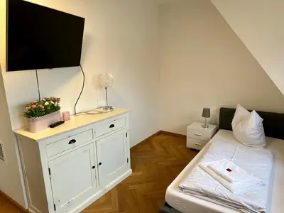 Ein Bett oder Betten in einem Zimmer der Unterkunft Exklusives Apartment mit einmaligem Blick zur Frauenkirche - Parkplatz kostenfrei