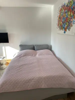 Ein Bett oder Betten in einem Zimmer der Unterkunft Apartment am HohenRand Dresden Leubnitz