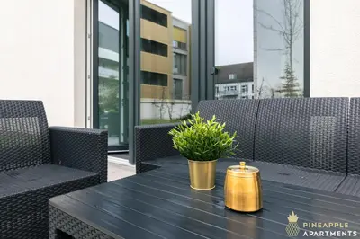 Ein Sitzbereich in der Unterkunft PINEAPPLE APARTMENTS - Altstadt II - 124qm - 1x free parking
