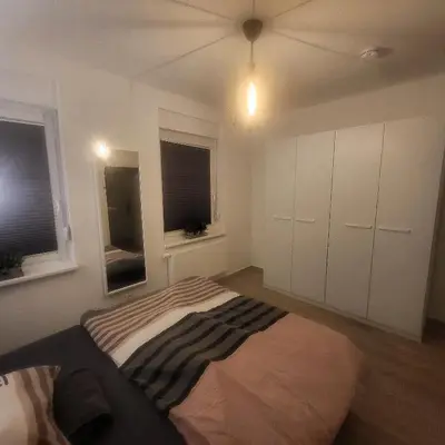 Ein Bett oder Betten in einem Zimmer der Unterkunft Ferienwohnung NR1