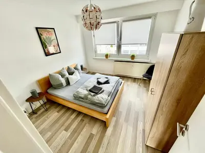 Ein Bett oder Betten in einem Zimmer der Unterkunft KMHosting modern & gemütlich im Zentrum