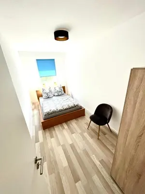 Ein Bett oder Betten in einem Zimmer der Unterkunft KMHosting modern & gemütlich im Zentrum