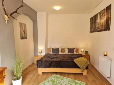 Ein Bett oder Betten in einem Zimmer der Unterkunft NEU: Großzügige Citywohnung mit XXL Dachterrasse!